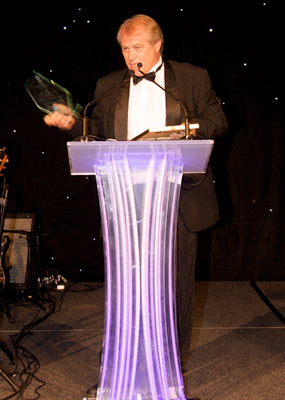 Colin West accepts award